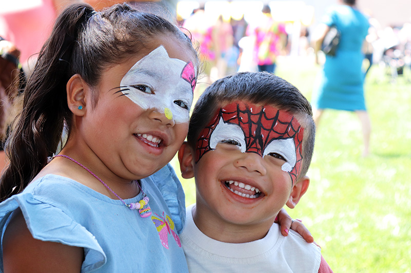 Smiling children outside the face painting booth at Bright Wood's picnic on July 13, 2024.